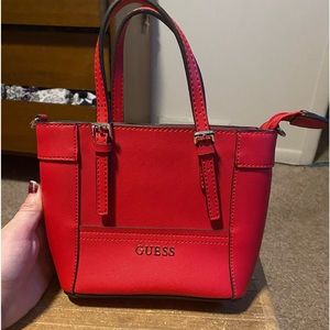 A mini Guess brand tote bag.  It is the “Delaney" edition. Almost new condition